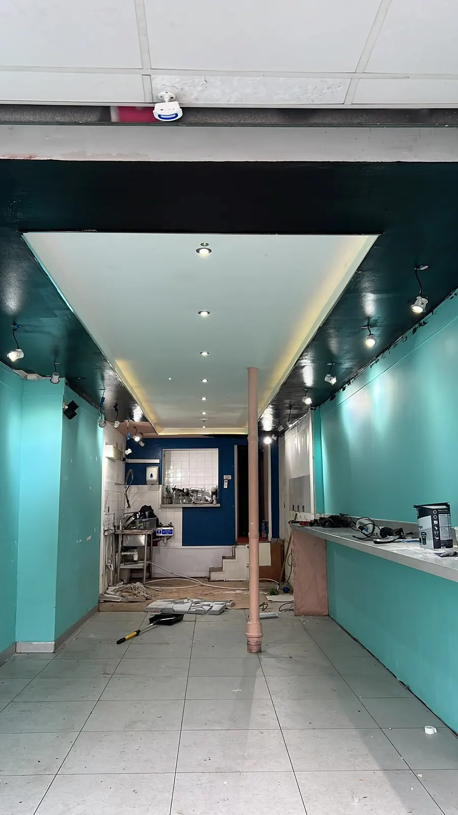 First-fix plumbing during strip-out, exposed soil pipe, Brentwood